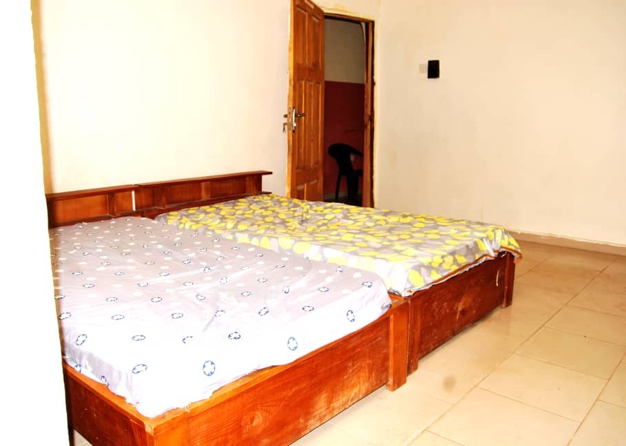 Two beds in a furnished room